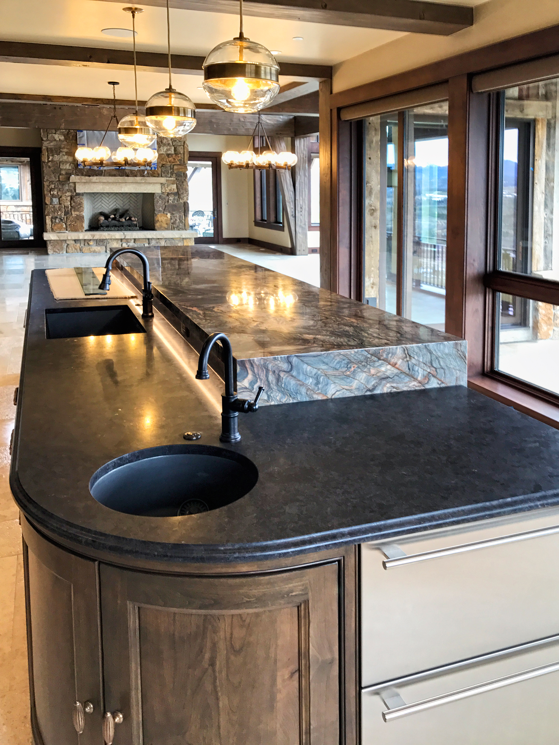 Fusion Granite itchen island. 6cm Mitred waterfall edges. 6cm mirrored flat polish edge. 6cm Laminate waterfall side panels. YK Stone Center Installed